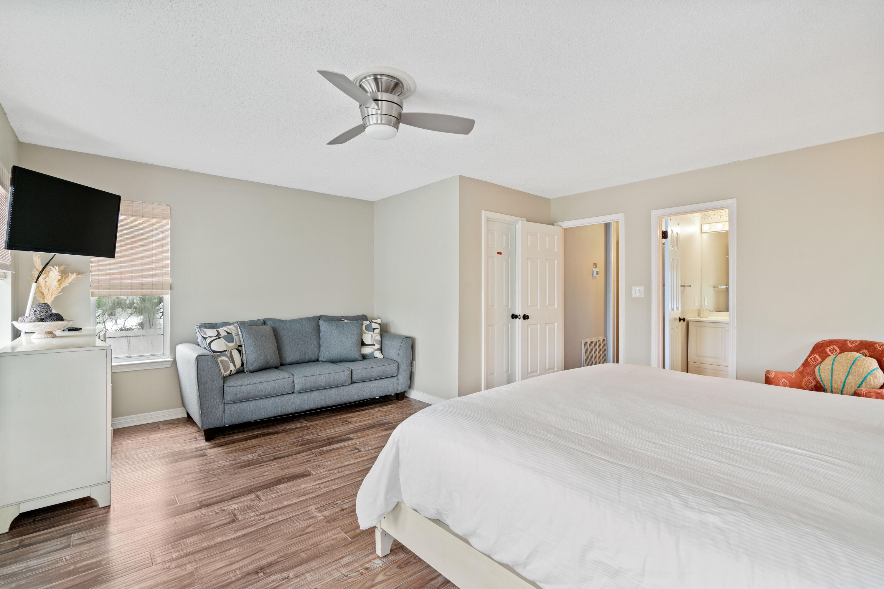 4508 Luke Avenue Destin, FL 32541 - Photo 17 of 48 a bedroom with a bed and a flat screen tv