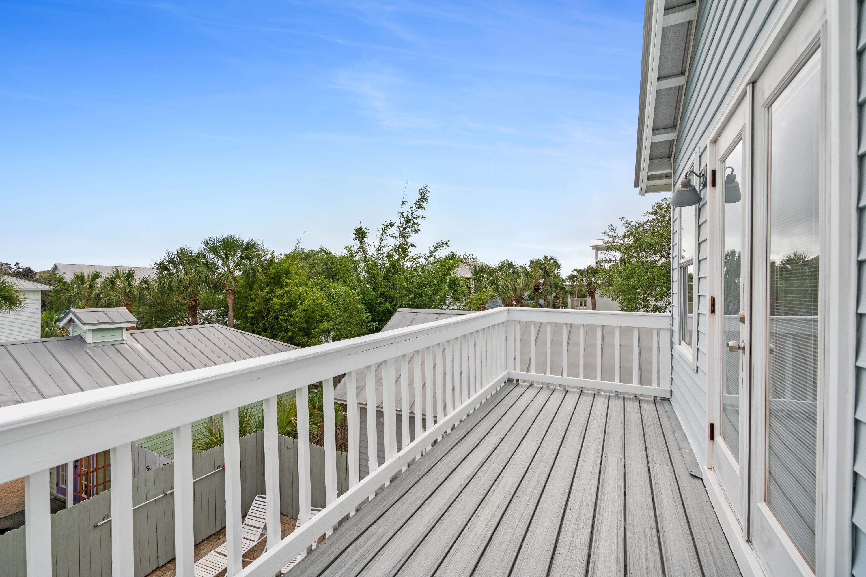 4508 Luke Avenue Destin, FL 32541 - Photo 21 of 48 a balcony with wooden floor and fence