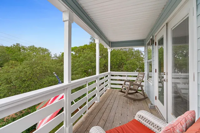 a view of balcony with couch and wooden floor
