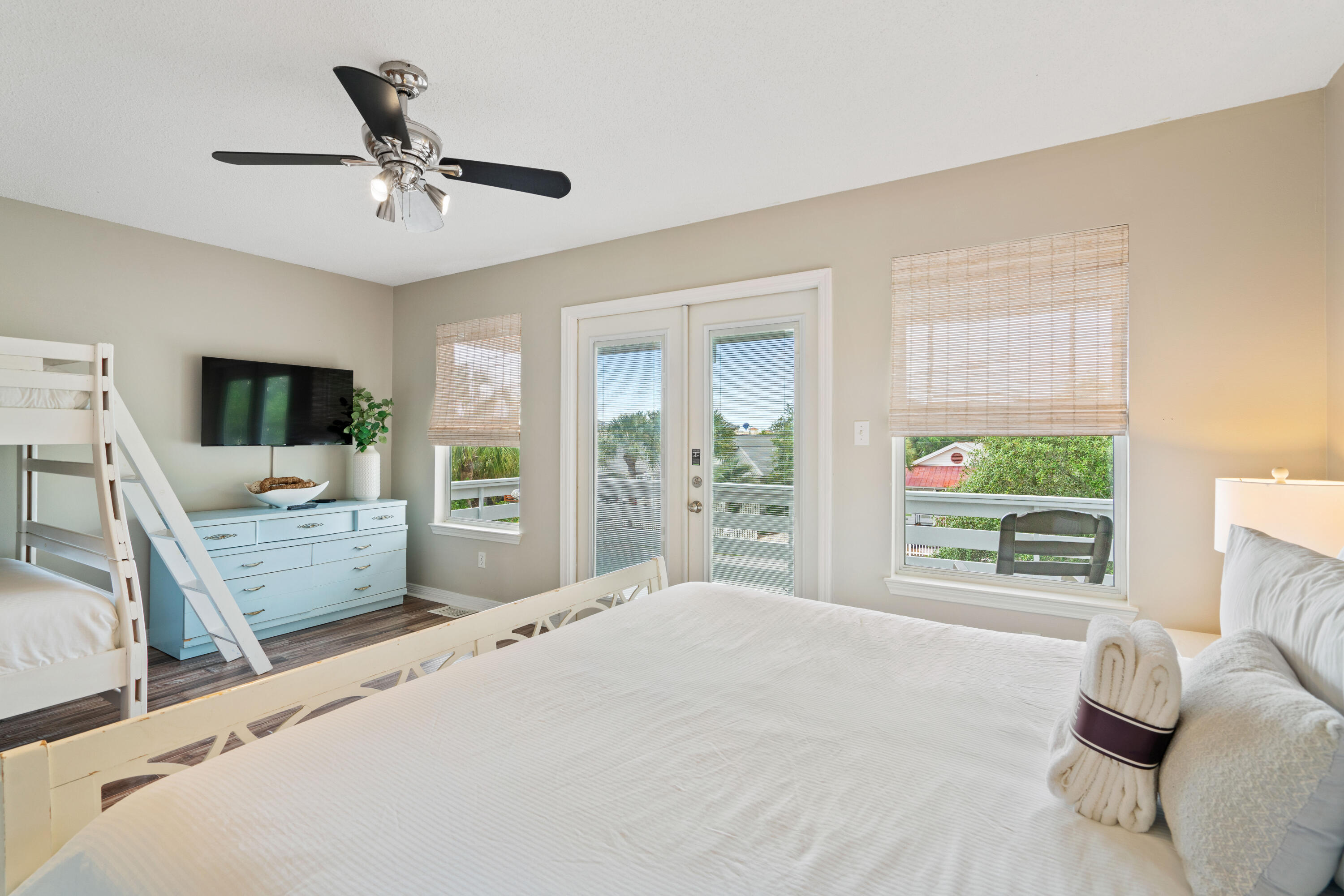 4508 Luke Avenue Destin, FL 32541 - Photo 26 of 48 a bedroom with a bed flat screen tv and a couch
