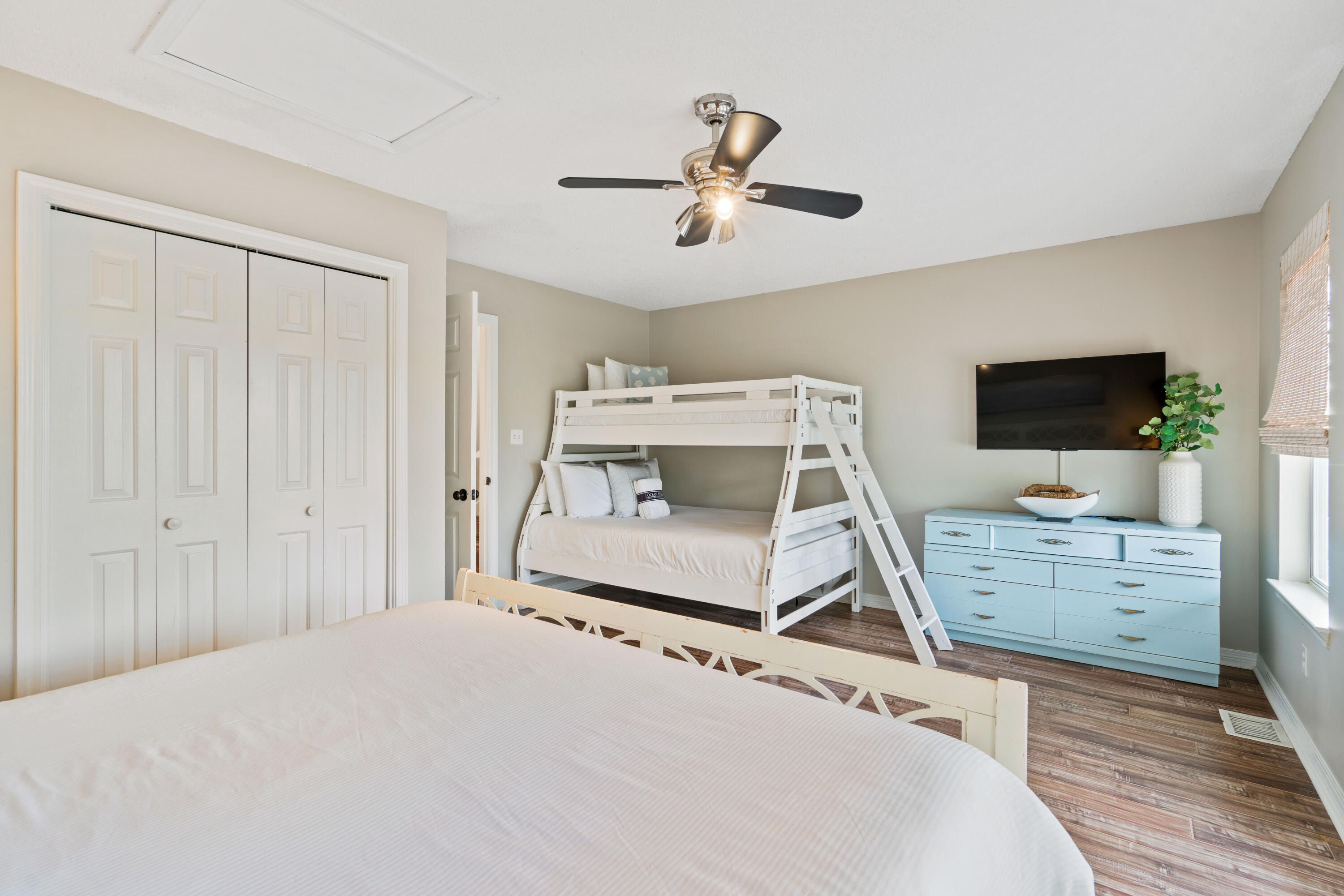 4508 Luke Avenue Destin, FL 32541 - Photo 29 of 48 a bedroom with a bed and flat screen tv