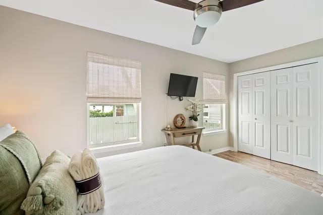 a bedroom with a bed and flat screen tv