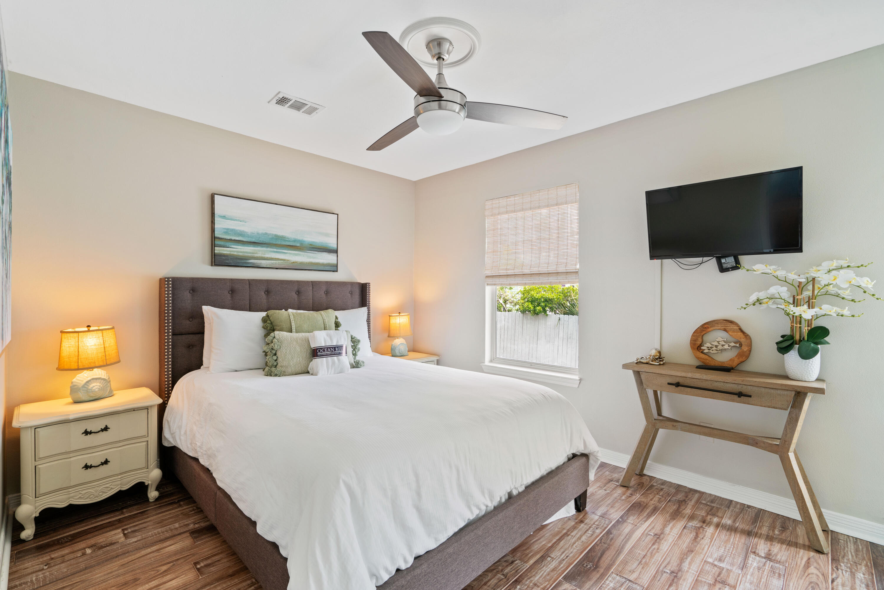 4508 Luke Avenue Destin, FL 32541 - Photo 34 of 48 a bedroom with a bed and a flat screen tv