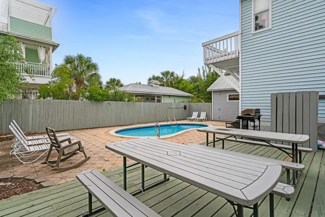 a view of a chairs and table on the deck