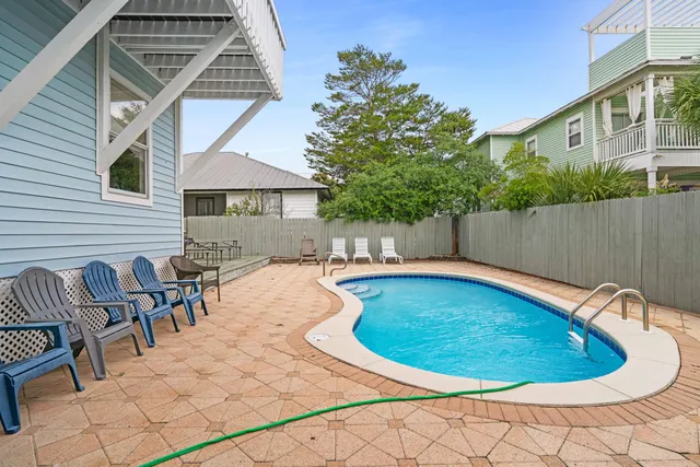 a view of swimming pool with seating space