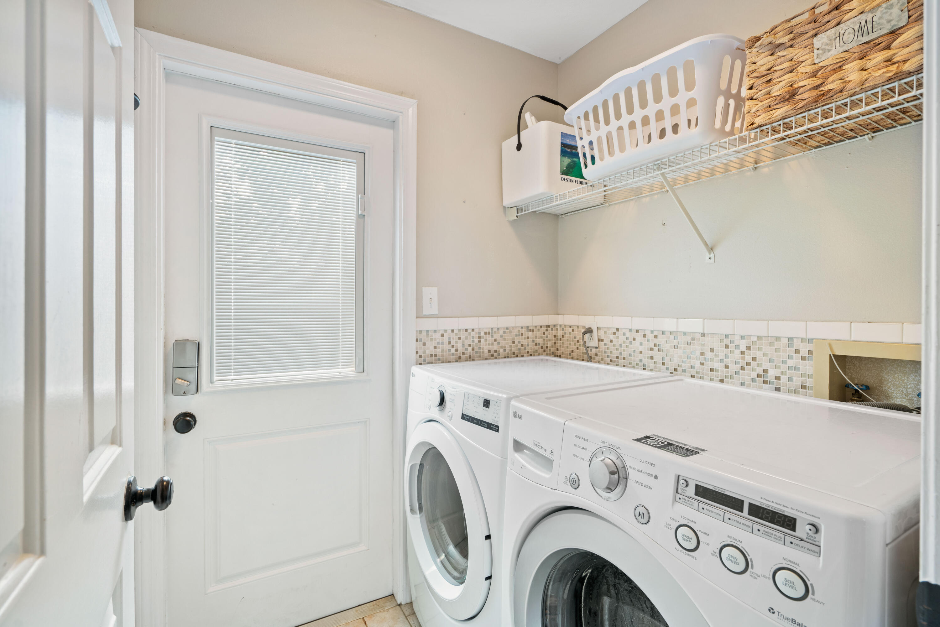 4508 Luke Avenue Destin, FL 32541 - Photo 37 of 48 a utility room with dryer and washer