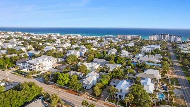 an aerial view of residential building and lake