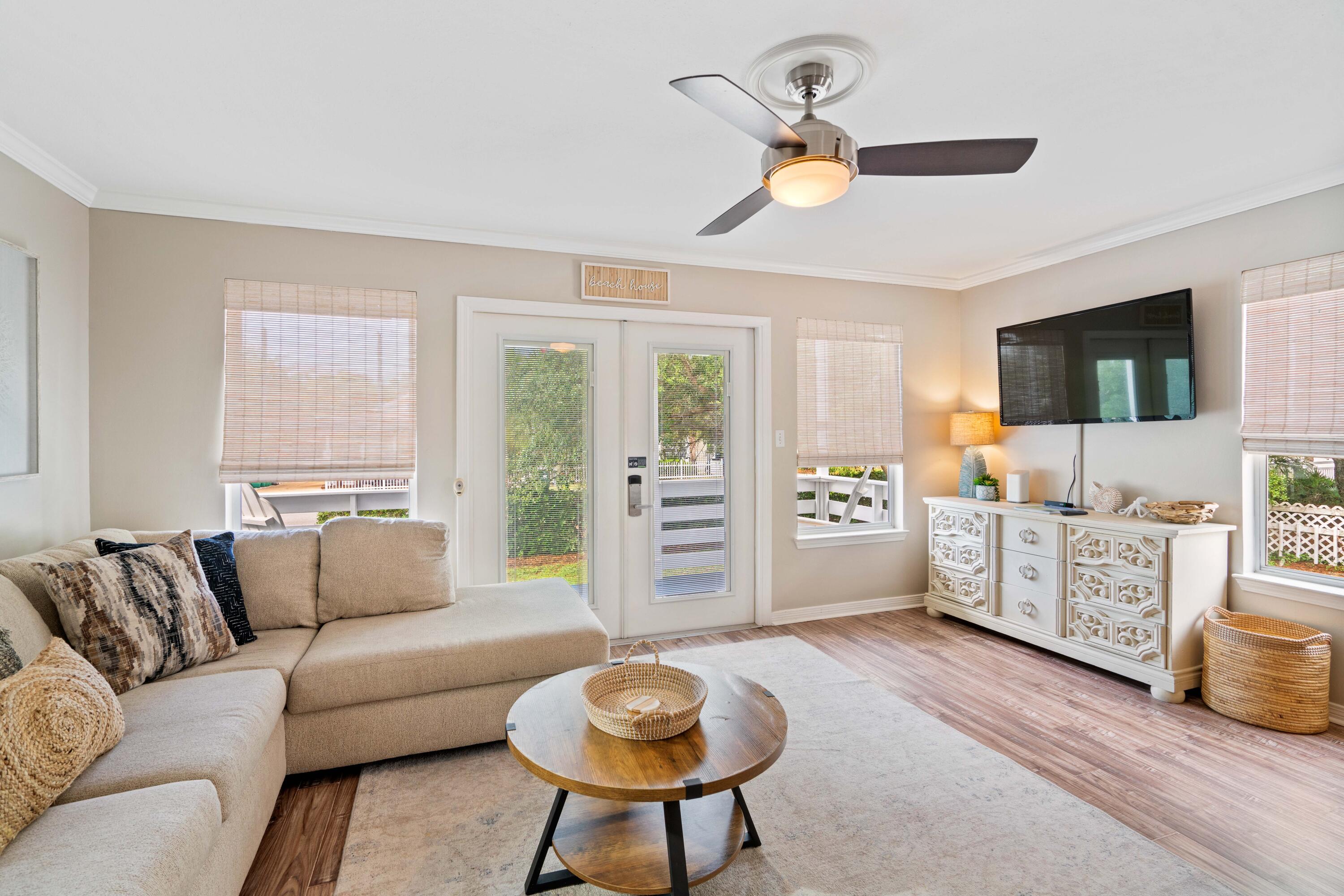 4508 Luke Avenue Destin, FL 32541 - Photo 5 of 48 a living room with furniture a flat screen tv and a window