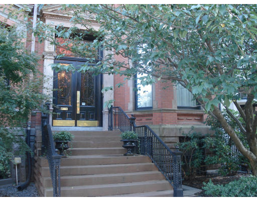 302 Commonwealth Avenue, Unit D Boston, MA 02115 - Photo 2 of 11 a front view of a house with plants and trees