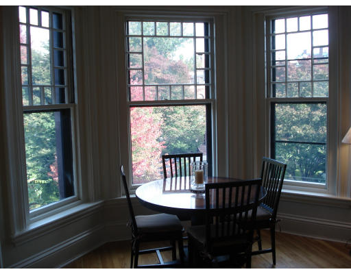 302 Commonwealth Avenue, Unit D Boston, MA 02115 - Photo 6 of 11 a view of a city from a dining room with large windows