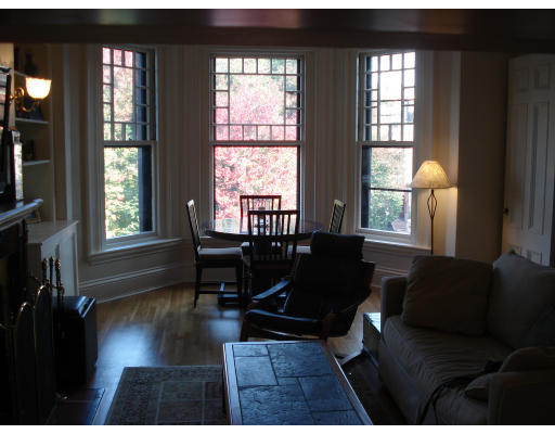 302 Commonwealth Avenue, Unit D Boston, MA 02115 - Photo 7 of 11 a living room with furniture and a window