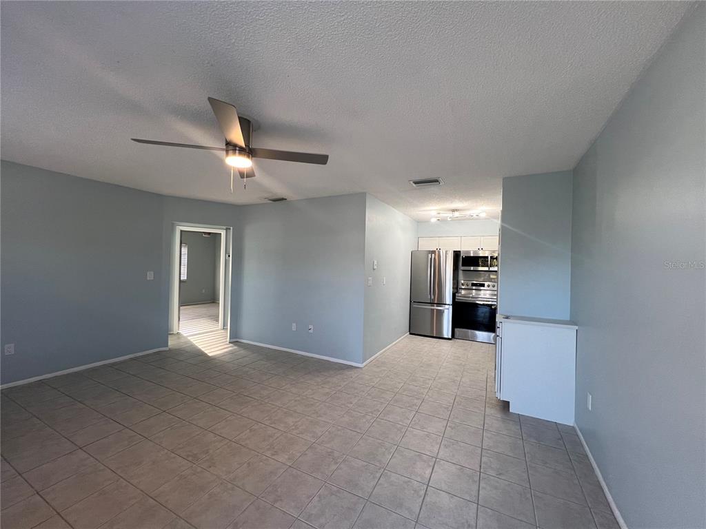 810 Kings Court, Unit D Punta Gorda, FL 33950 - Photo 2 of 10 a view of a kitchen with a sink and a refrigerator