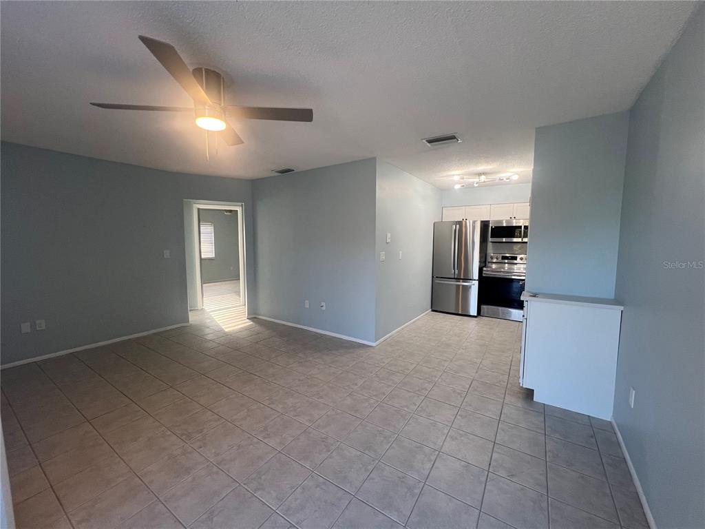 810 Kings Court, Unit D Punta Gorda, FL 33950 - Photo 3 of 10 a view of empty room with a kitchen