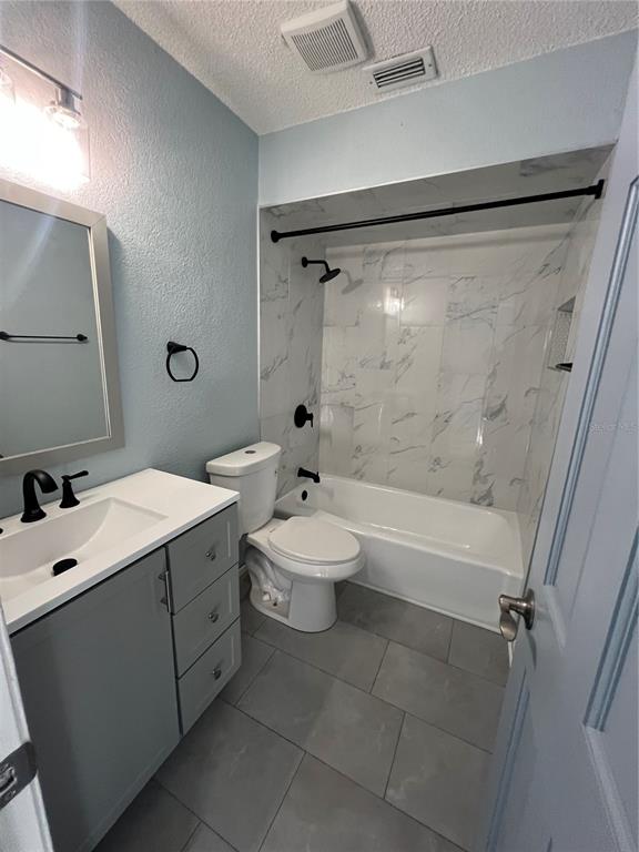 810 Kings Court, Unit D Punta Gorda, FL 33950 - Photo 7 of 10 a bathroom with a sink mirror toilet and bathtub