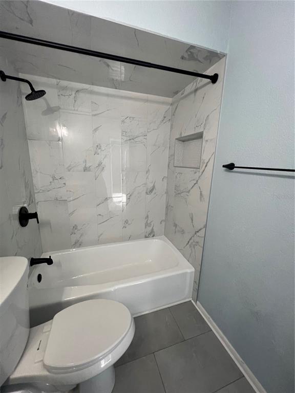 810 Kings Court, Unit D Punta Gorda, FL 33950 - Photo 8 of 10 a bathroom with a toilet and a shower