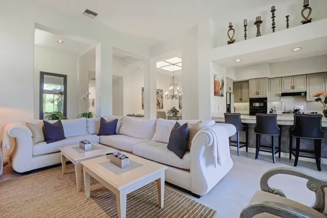 a living room with furniture or couch and a kitchen