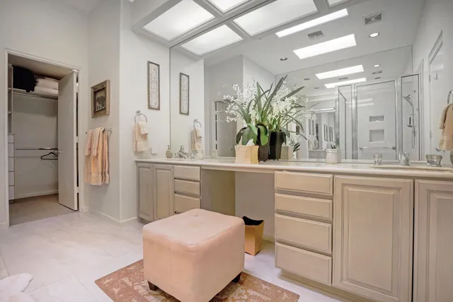 a bedroom with a bed and a view of closet