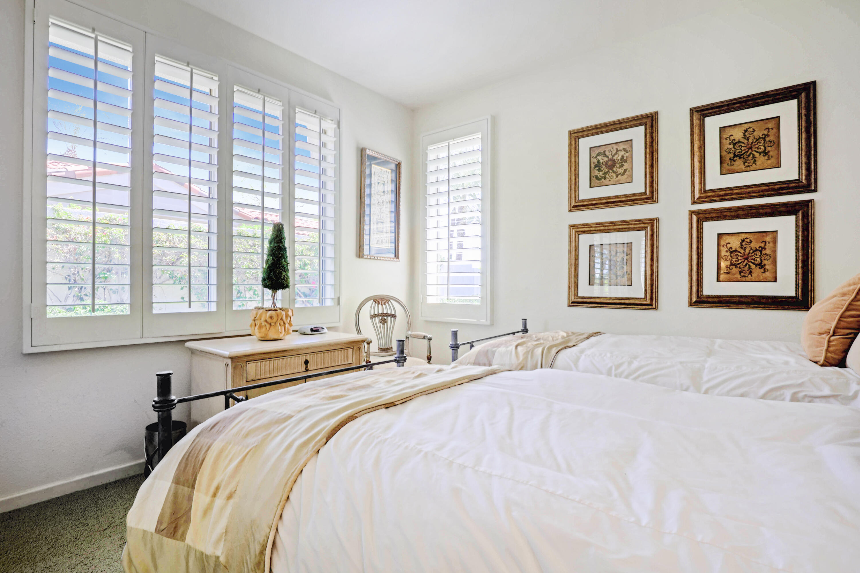 371 Indian Ridge Drive Palm Desert, CA 92211 - Photo 22 of 32 a bedroom with a bed and a large window