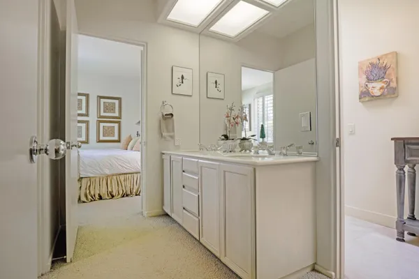 a bedroom with a bed and chair