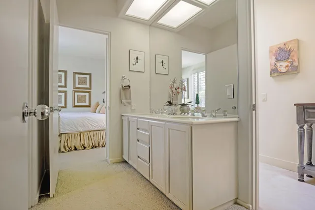 a bedroom with a bed and chair