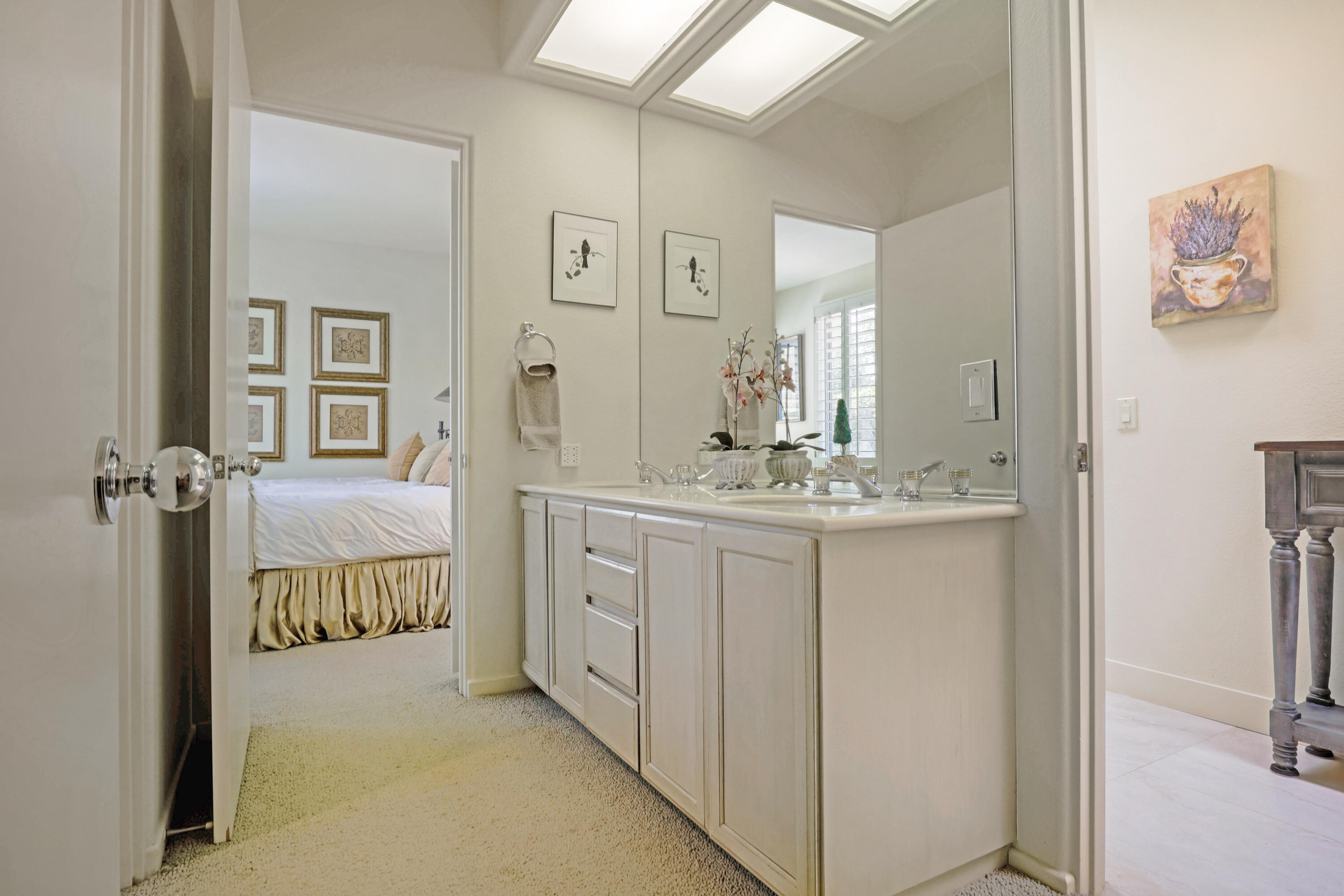 371 Indian Ridge Drive Palm Desert, CA 92211 - Photo 24 of 32 a bathroom with a double vanity sink and mirror