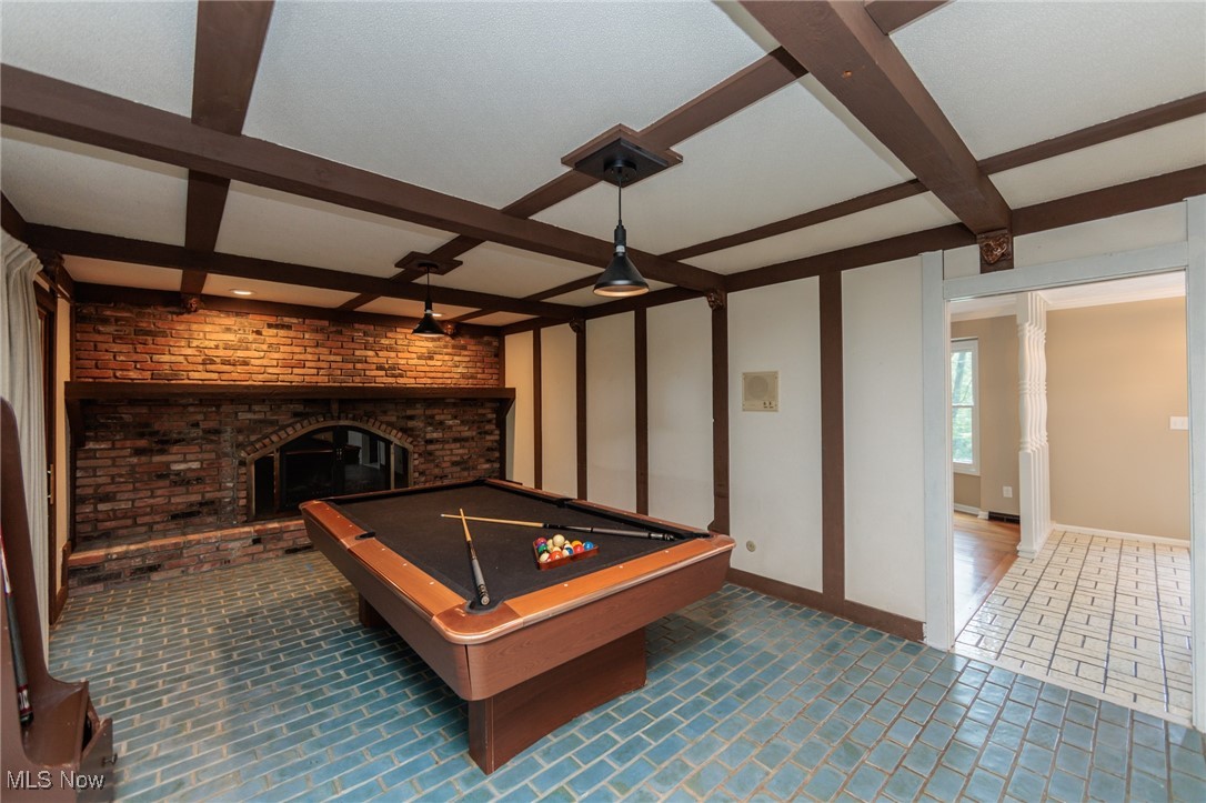 13655 Sperry Road Novelty, OH 44072 - Photo 9 of 32 Playroom featuring beam ceiling, billiards table, a fireplace, and brick wall