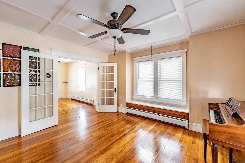 48 Rimmon Avenue Chicopee, MA 01013 - Photo 12 of 41 a view of an empty room with window and wooden floor