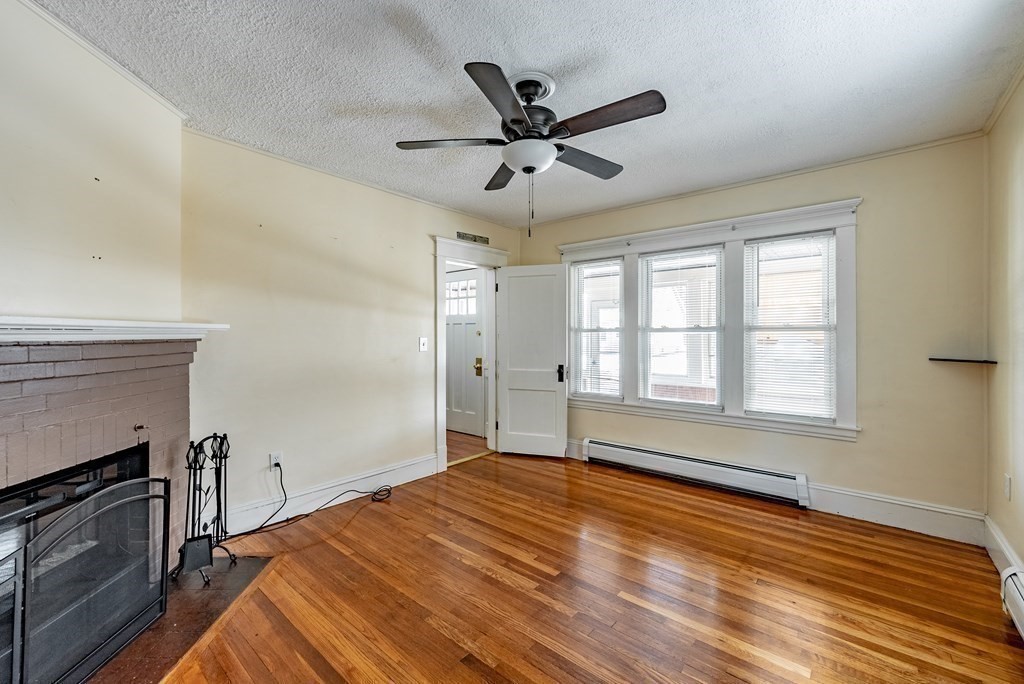 48 Rimmon Avenue Chicopee, MA 01013 - Photo 14 of 41 a view of empty room with wooden floor and fan