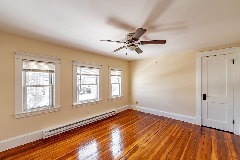 48 Rimmon Avenue Chicopee, MA 01013 - Photo 17 of 41 an empty room with wooden floor and windows