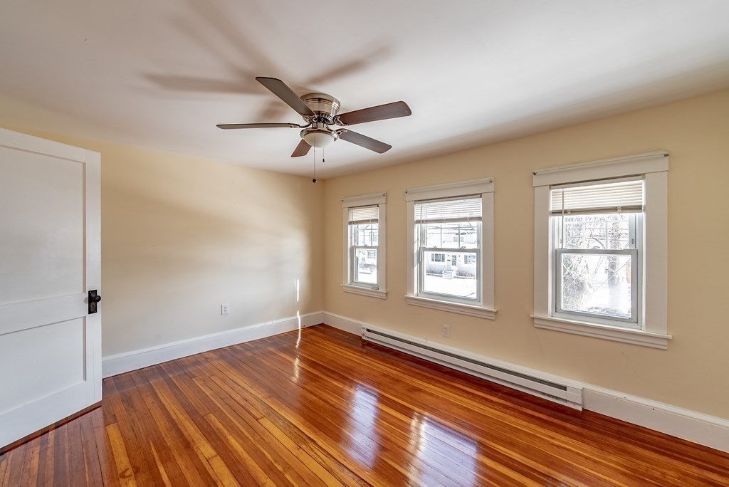 48 Rimmon Avenue Chicopee, MA 01013 - Photo 18 of 41 a view of an empty room with wooden floor and a window
