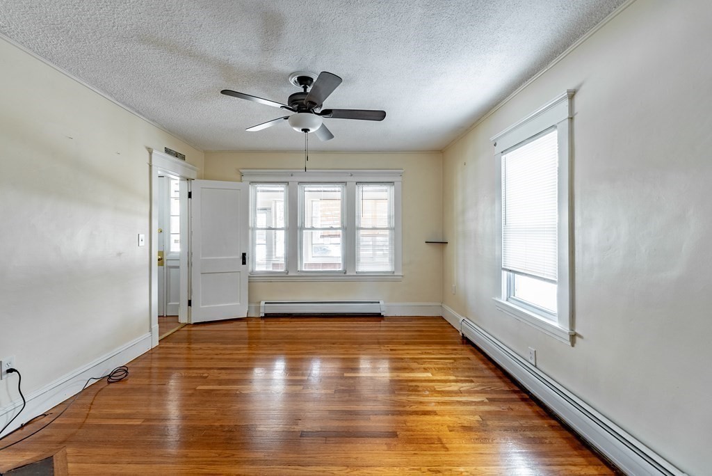 48 Rimmon Avenue Chicopee, MA 01013 - Photo 20 of 41 a view of empty room with wooden floor and fan