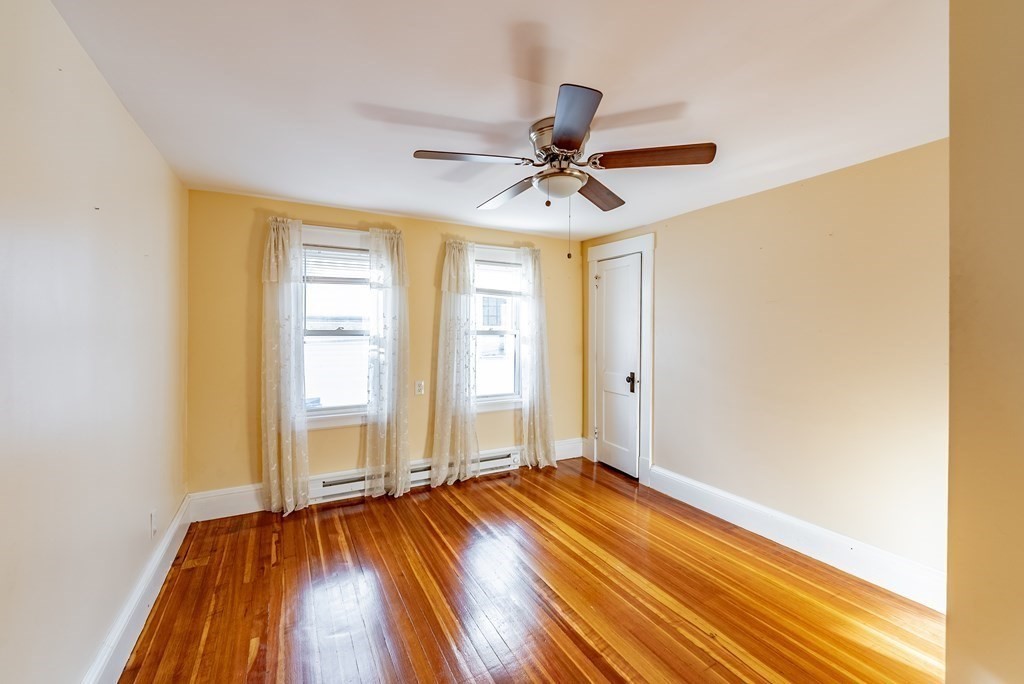 48 Rimmon Avenue Chicopee, MA 01013 - Photo 22 of 41 a view of empty room with wooden floor and fan