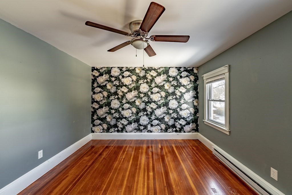 48 Rimmon Avenue Chicopee, MA 01013 - Photo 26 of 41 a view of a hallway with wooden floor and a chandelier fan