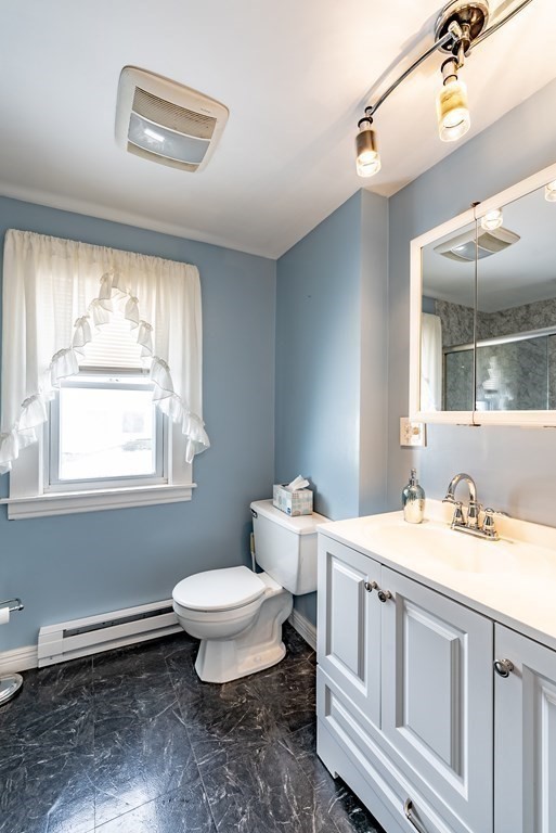 48 Rimmon Avenue Chicopee, MA 01013 - Photo 30 of 41 a bathroom with a toilet sink and mirror