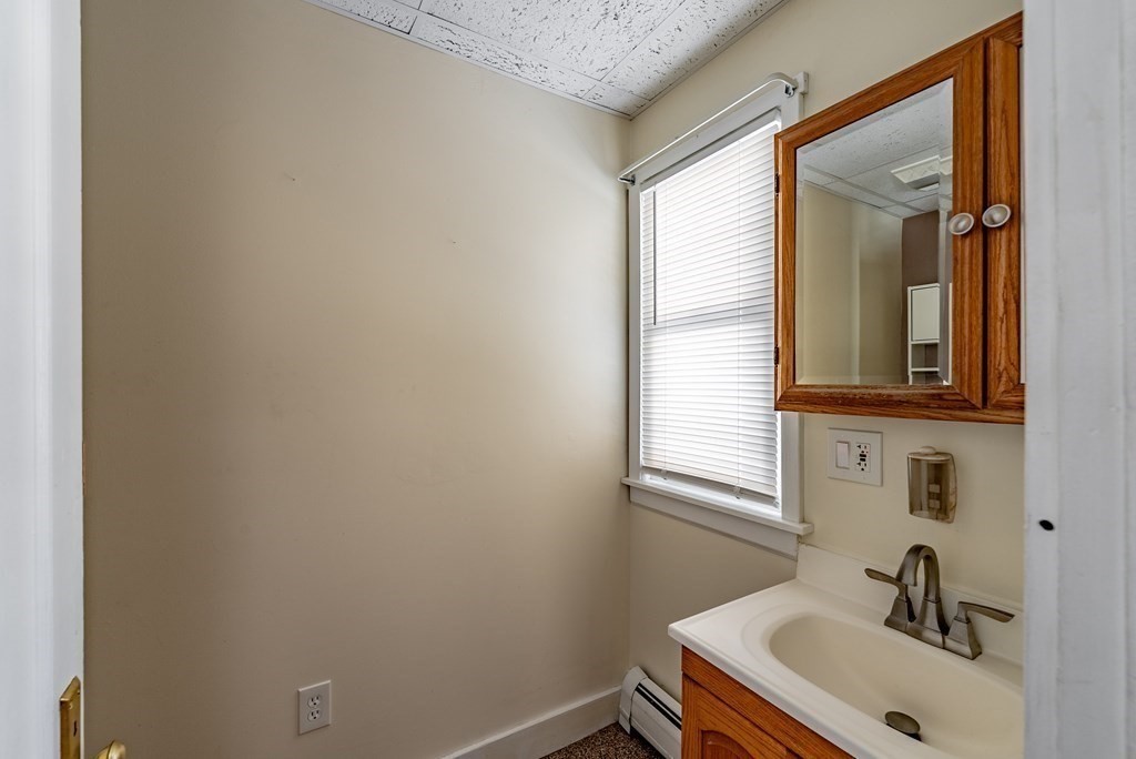 48 Rimmon Avenue Chicopee, MA 01013 - Photo 32 of 41 a bathroom with a sink and a window