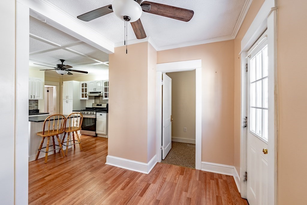 48 Rimmon Avenue Chicopee, MA 01013 - Photo 7 of 41 a view of a dining room and livingroom with furniture wooden floor a chandelier