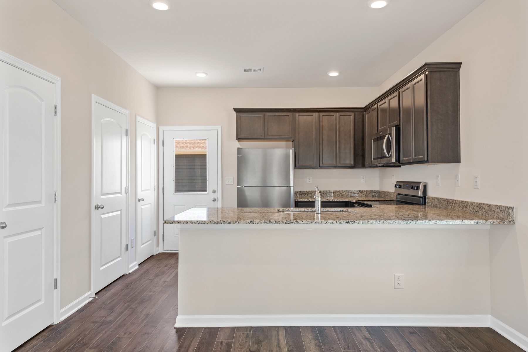 6077 Cullen Drive La Vergne, TN 37086 - Photo 3 of 7 a kitchen with stainless steel appliances granite countertop a sink refrigerator and cabinets