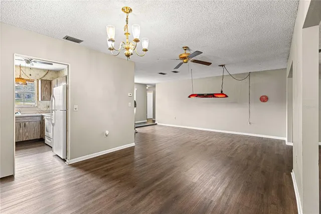 a view of a room with wooden floor and cabinet