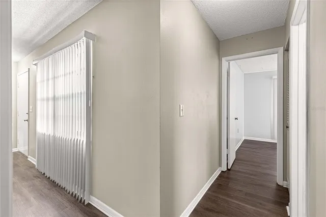 a view of an entryway with wooden floor