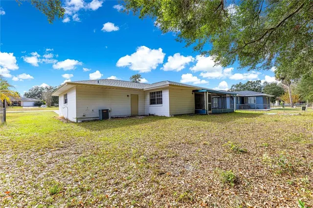 a front view of a house with a garden and yard