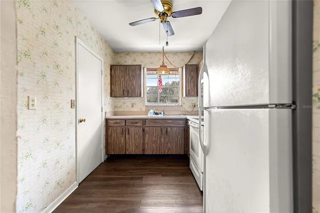 a bathroom with a sink a mirror and a shower