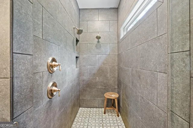 a view of a hallway with wooden shelves