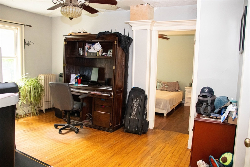 85-87 Slater Street Webster, MA 01570 - Photo 30 of 41 a view of a workspace with furniture and a window