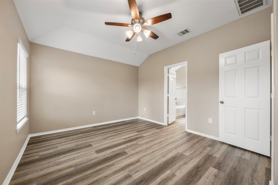 175 Courageous Side Way Magnolia, TX 77354 - Photo 15 of 28 wooden floor in an empty room with a window