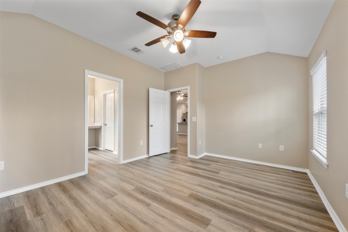 175 Courageous Side Way Magnolia, TX 77354 - Photo 16 of 28 wooden floor in an empty room with a window