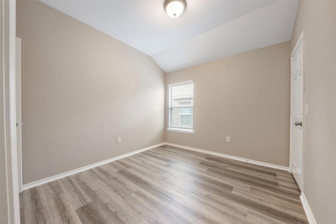 175 Courageous Side Way Magnolia, TX 77354 - Photo 19 of 28 a view of room with window and hardwood floor