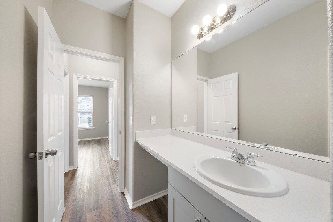 175 Courageous Side Way Magnolia, TX 77354 - Photo 22 of 28 a bathroom with a sink and a mirror
