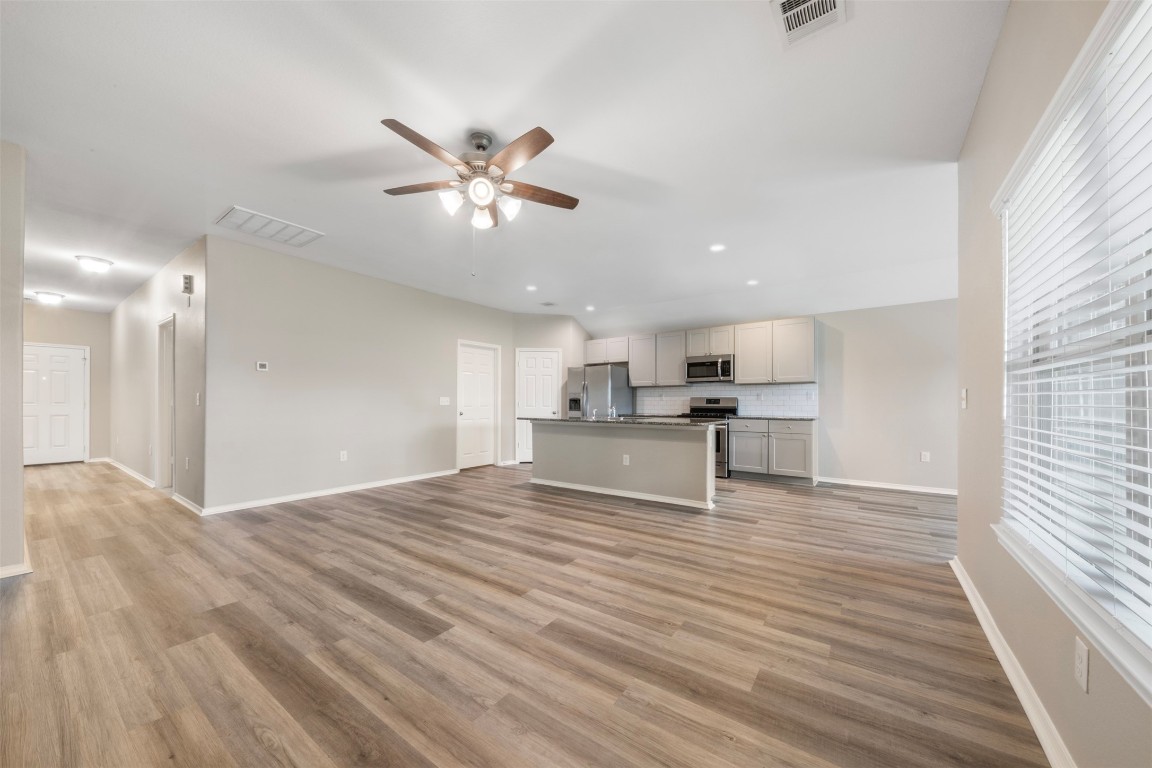 175 Courageous Side Way Magnolia, TX 77354 - Photo 5 of 28 a view of kitchen with wooden floor and window