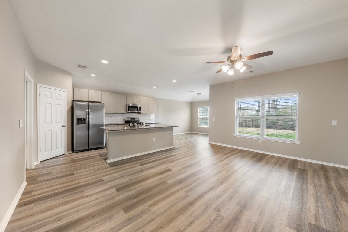175 Courageous Side Way Magnolia, TX 77354 - Photo 7 of 28 a view of kitchen with granite countertop cabinets and refrigerator