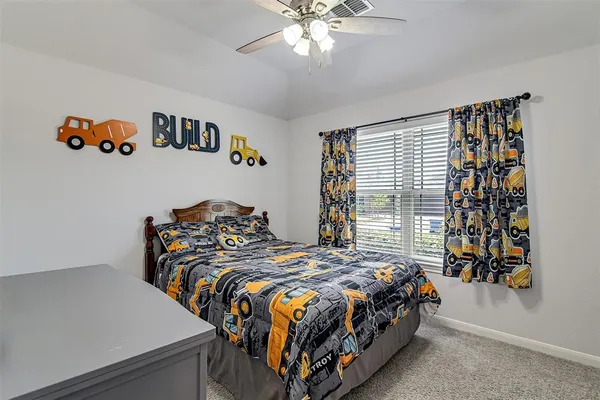 a bedroom with bed and a window